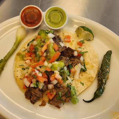 Santiago's $3 street tacos with cilantro and onions